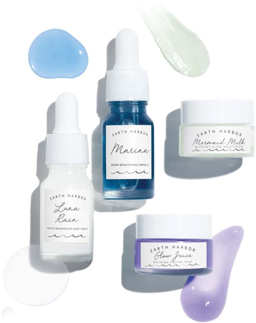 Skincare bottles with different colors of gel or cream, labeled Marina, Luna Rain, Mermaid Milk, and Glow Juice.