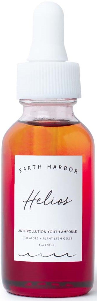 Small amber glass dropper bottle with a white label and white dropper cap. The label reads 'Earth Harbor Helios.'
