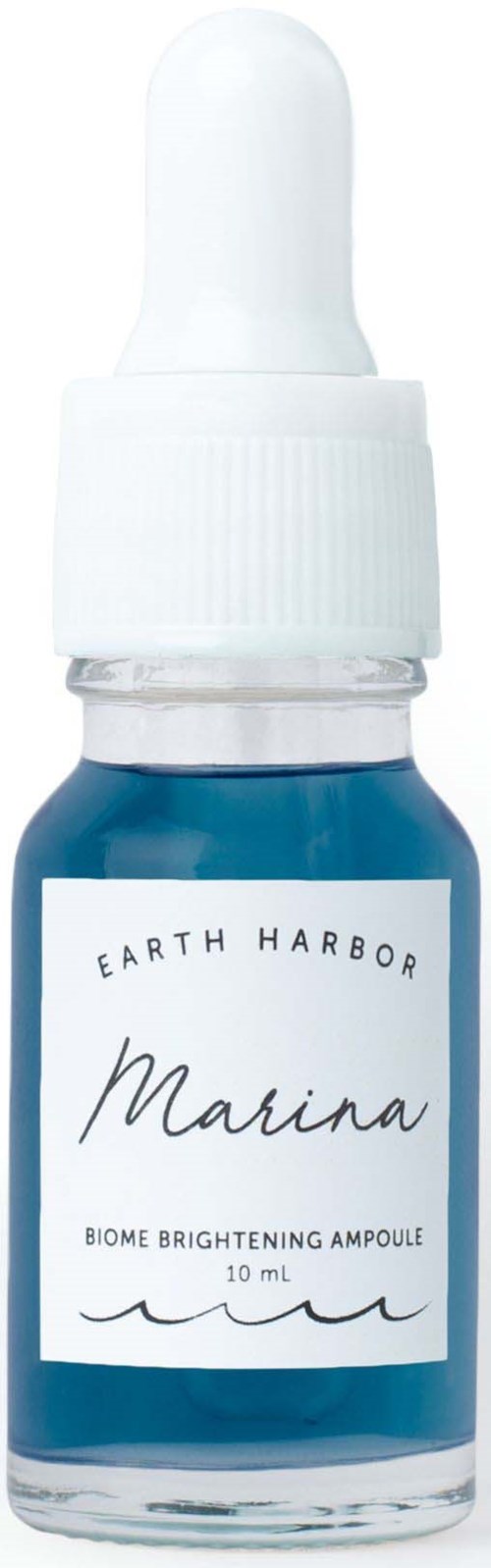 Kleine blauwe fles met witte druppeldop, gelabeld 'Earth Harbor Marina' met tekst over oplichtende huid.