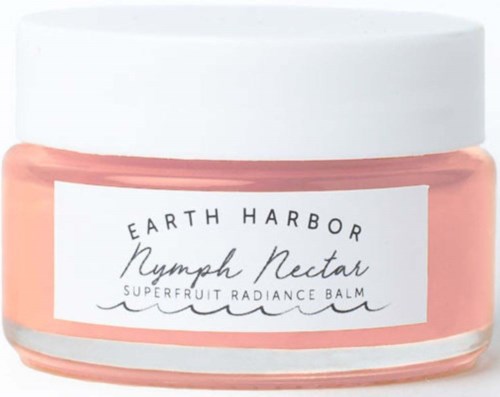 A jar of Earth Harbor Nymph Nectar superfruit radiance balm with a white lid and pink contents.