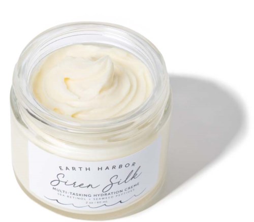 Een potje Earth Harbor Siren Silk hydratatiecrème met crème erin.