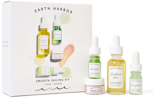 Set of skincare bottles and cream, labeled with calming and renewing product names, with a matching box for a sailing theme.