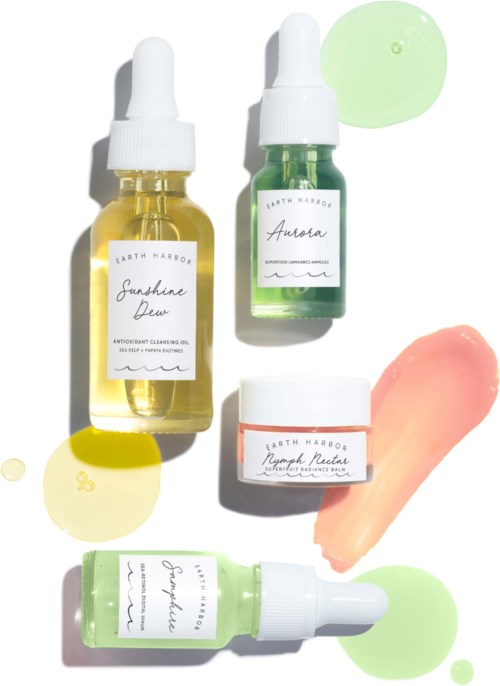 Five skincare bottles with labels and colorful cream or serum swirls in pastel colors.