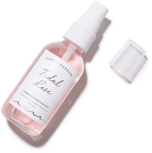 A pink spray bottle labeled 'Tidal Rose' with a white cap removed, showing the spray nozzle.