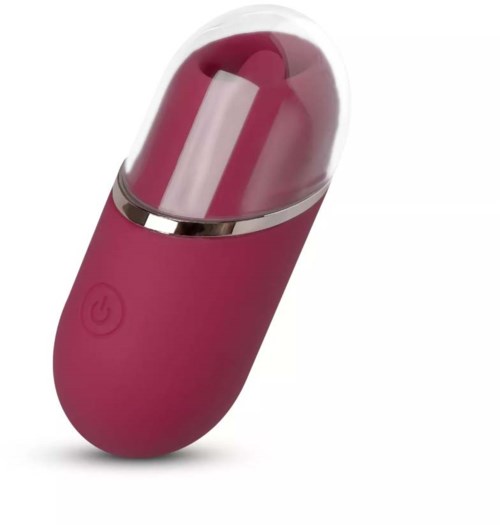 A pink capsule-shaped device with a power button and a transparent top section.