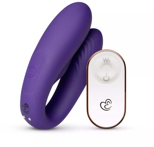 Ein lila, geschwungener Apparat mit Tasten und Fernbedienung, wahrscheinlich ein persönliches Massagegerät oder Produkt für sexuelle Gesundheit.