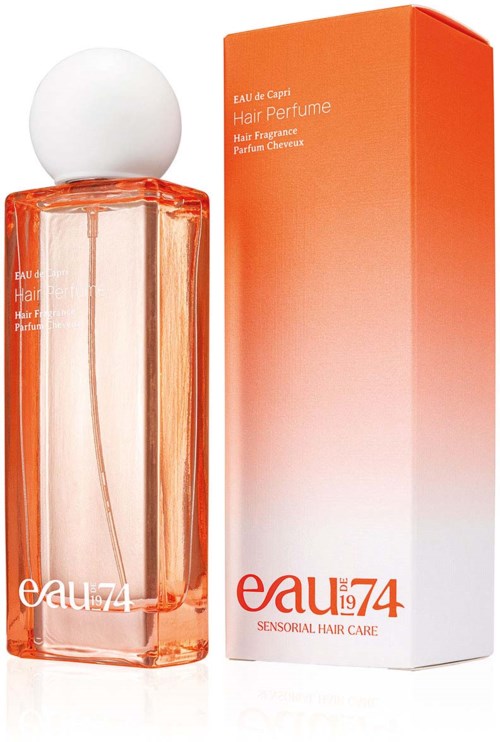 A perfume bottle with bright orange liquid and a white cap, next to an orange to white gradient box.