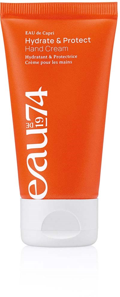Orange tube of hand cream with white cap, labeled 'Eau de Capri Hydrate & Protect Hand Cream'.