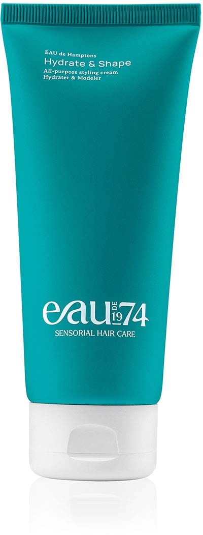 A teal tube of hair cream labeled "Eau 74 Hydrate & Shape," designed for all-purpose styling and hair care.