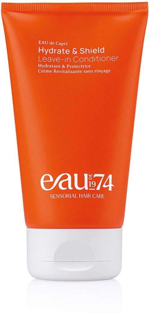 Orange tube of Leave-in Conditioner with white cap, labeled Hydrate & Shield, for hair care.
