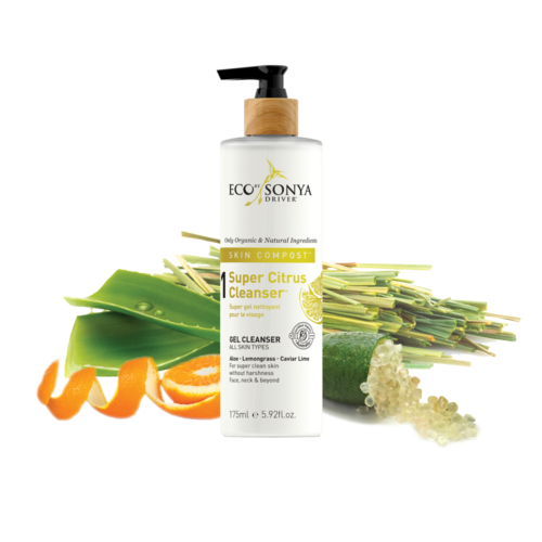 A white bottle labeled 'Eco Sonya Super Citrus Cleanser' with a pump, surrounded by citrus slices and aloe leaves.
