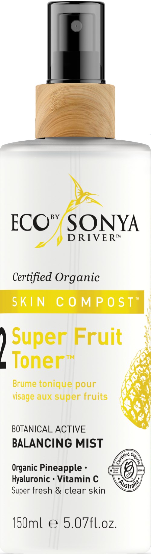 A clear bottle with a black pump, wooden top, and yellow label features organic pineapple, super fruit toner. Hyundai.