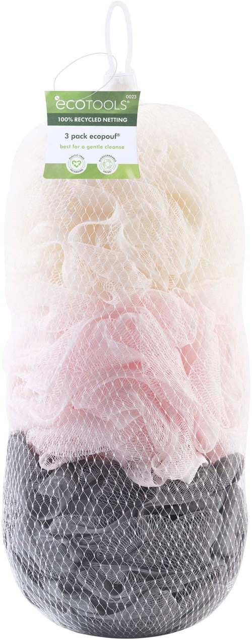 A package contains three different colored mesh exfoliating poufs in white, pink, and black, hanging on a white background.