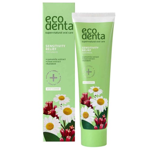 Grön tub och förpackning av Eco Denta känslighetslindrande tandkräm med blommor och örter.