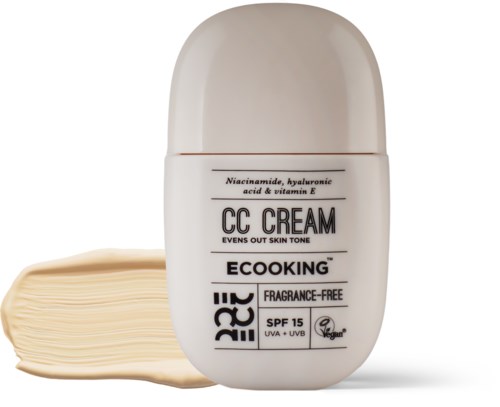 A small bottle labeled 'CC Cream' with a beige color, and a small amount of cream squeezed out beside it.