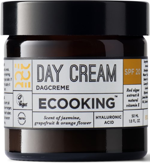 A jar labeled EcoKing Day Cream with SPF 20, jasmine, grape, orange scent, and hyaluronic acid. Black lid.