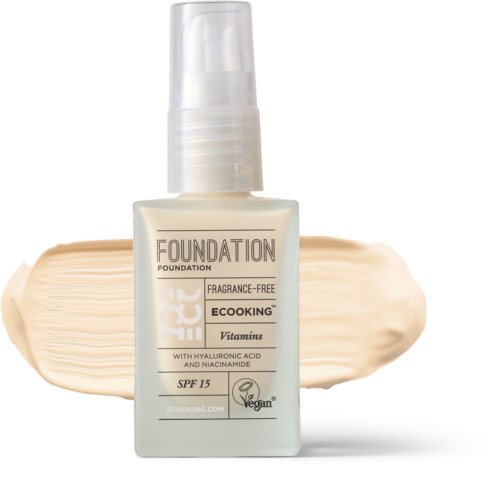 Bottle labeled 'Foundation Ecoicing,' fragrance-free with SPF 15, contains vitamins, hyaluronic acid, and niacinamide.