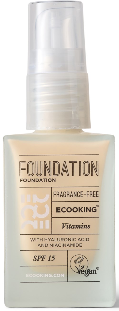 A bottle of foundation makeup with SPF 15, fragrance-free, vegan, and contains vitamins, hyaluronic acid, and niacinamide.