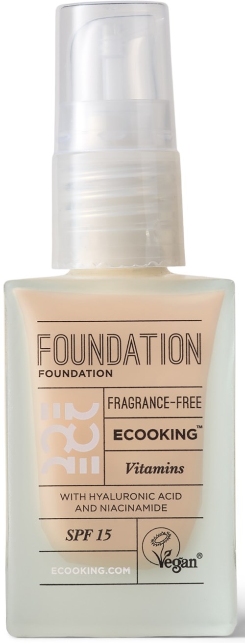 A bottle of vegan foundation with SPF 15, fragrance-free, containing vitamins, hyaluronic acid, and niacinamide.