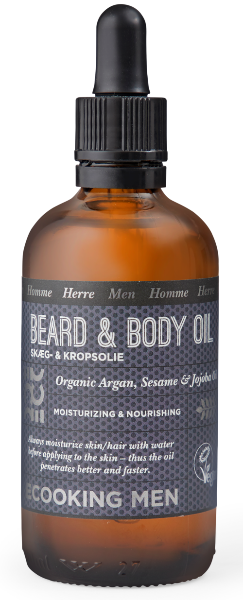 Amber glass bottle with a black dropper cap, label says beard and body oil, organic ingredients, for men.