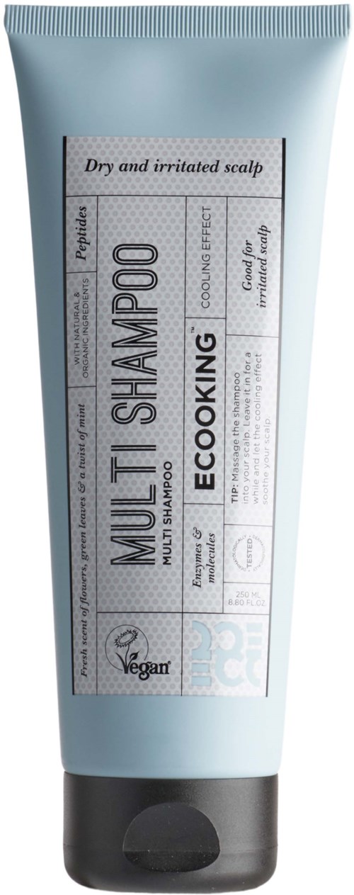 A light blue tube of eco-friendly shampoo for dry, irritated scalp, labeled as vegan with black cap.