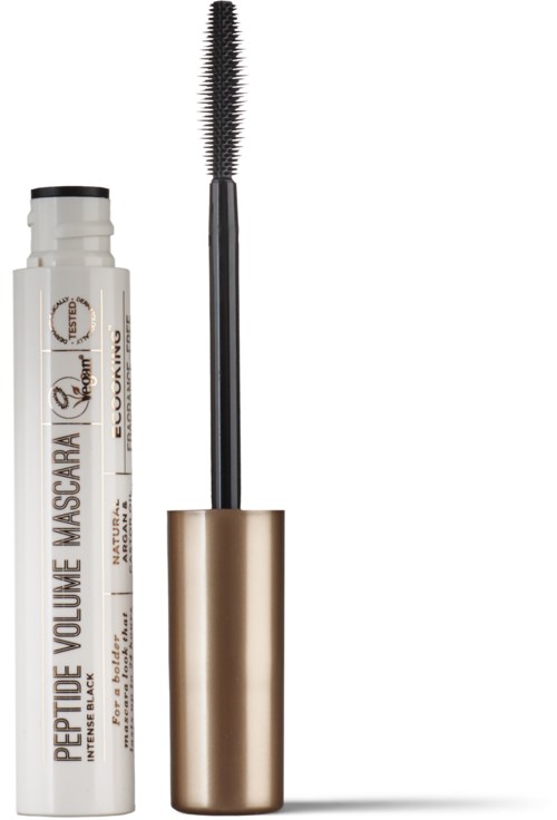 A mascara tube, wand with brush, and gold cap. The mascara is white with black and gold accents.