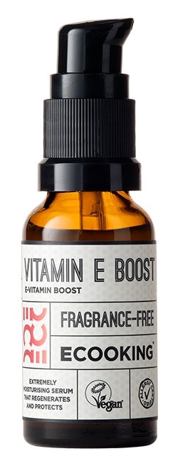 An amber bottle with a black pump, labeled 'Vitamin E Boost', 'Fragrance-Free', and 'EcoKing'. It is a serum container.