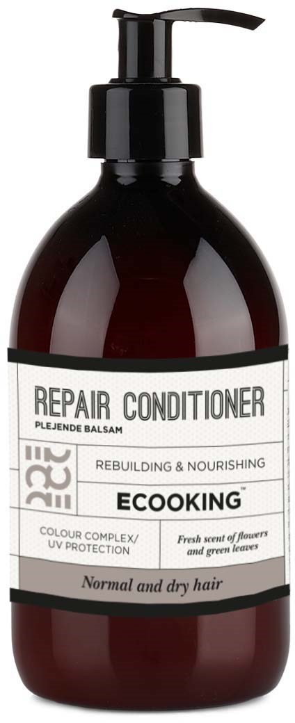 En brun flaska med pump innehåller reparationsbalsam för normalt och torrt hår.