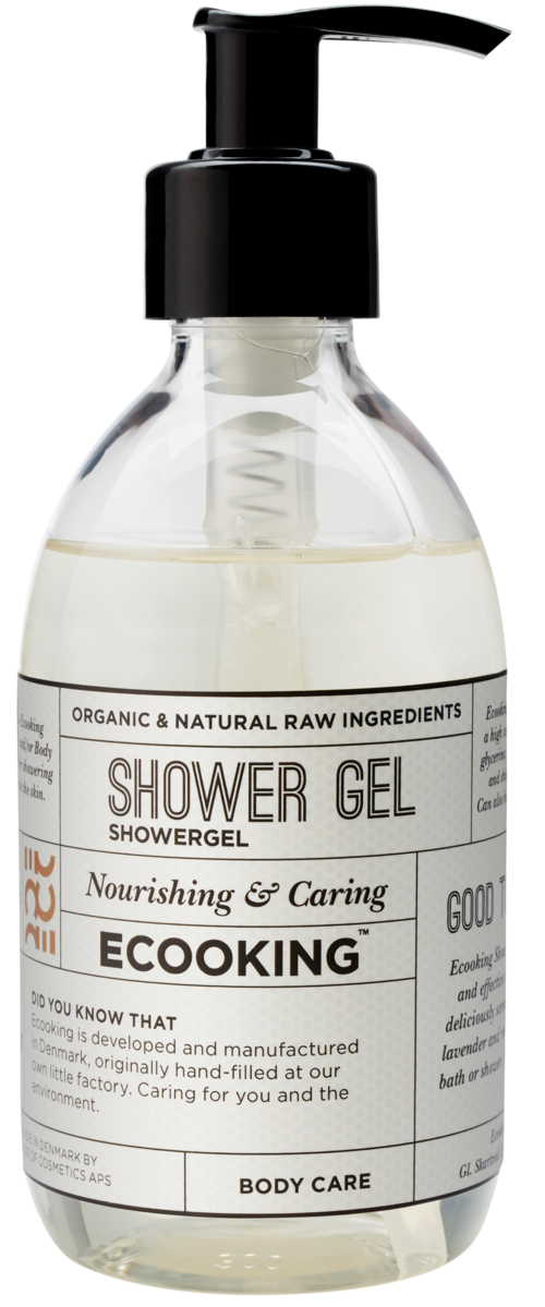 Eine klare Duschgel-Flasche mit schwarzem Pumpkopf, Beschriftung sagt 'Shower Gel' und 'Nourishing and Caring'.