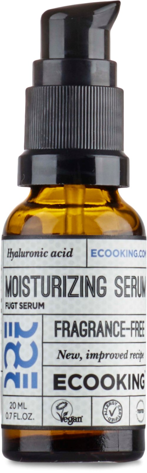 A small brown bottle with a black pump, labeled as moisturizing serum with hyaluronic acid, fragrance-free, vegan, and 20ml.