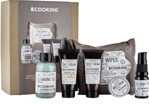 A set of eco-friendly skincare products including creams, gels, wipes, and a spray in black, white, and light blue packaging.