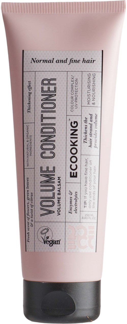 A pink tube labeled 'Volume Conditioner' for normal and fine hair, with vegan and eco-friendly ingredients.