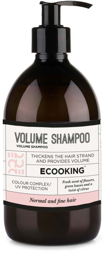 En mörk flaska med pump, märkt 'Volume Shampoo' för att göra tunt hår tjockare och ge volym.