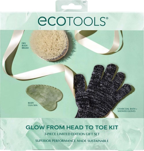 A gift set includes a dry body brush, a green Guasha tool, and a black Charcoal bath and shower gloves.