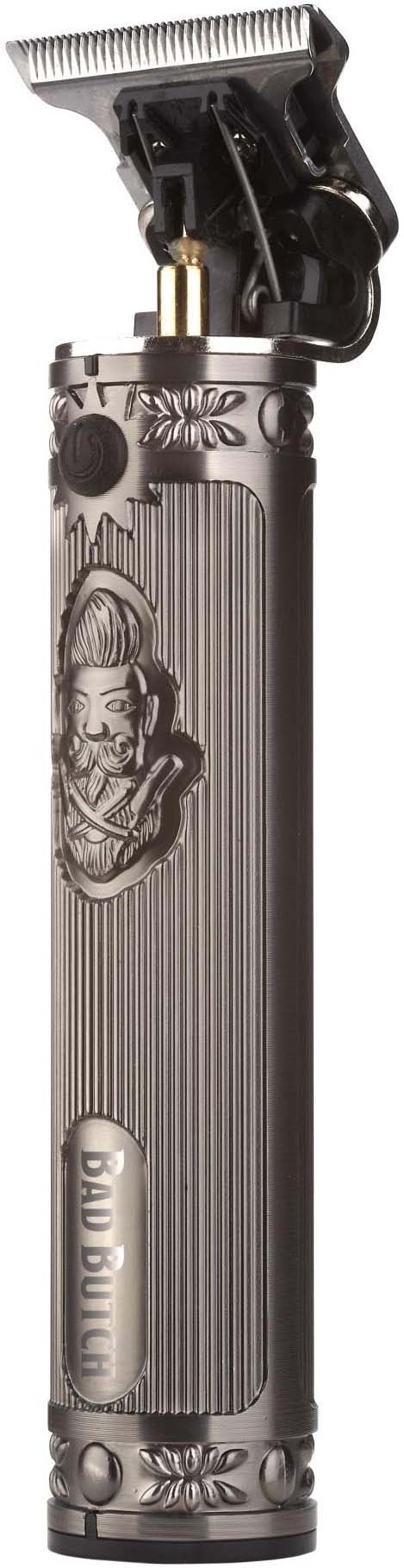 A hair clipper with a decorative handle featuring a cartoon face and floral designs.