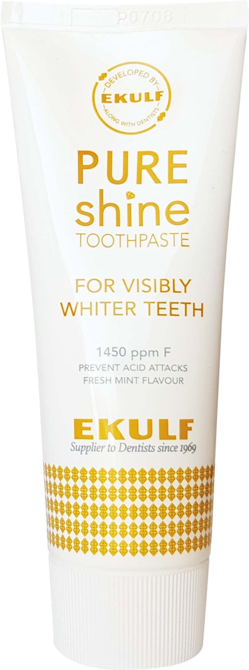 A white tube of Ekulf Pure Shine Toothpaste with gold and orange text promoting white teeth, mint flavor, and acidity protection.