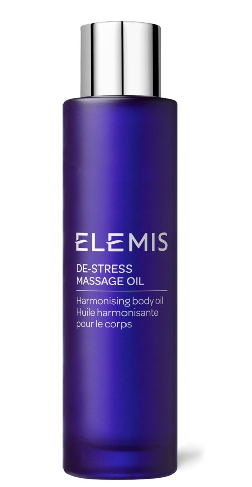Eine lange, lila Flasche mit silberner Kappe. Sie trägt die Aufschrift 'Elemis' und 'De-Stress Massage Oil'.