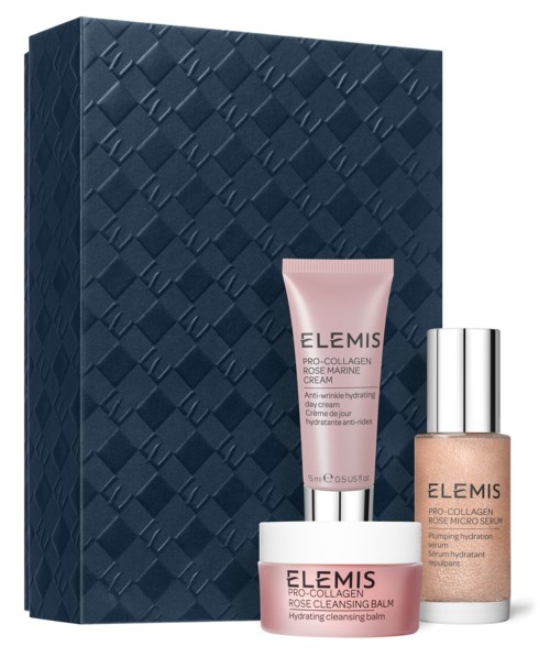 Ein Set Hautpflegeprodukte mit einer blauen strukturierten Schachtel, einschließlich einer rosa Creme, Reinigungsbalsam und Serum.