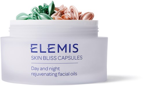 Ein Behälter mit bunten Gesichtsölen, etiketti ELEMIS Skin Bliss Capsules für Tag und Nacht.