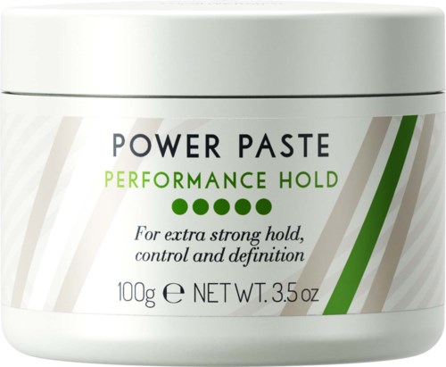 En hvit krukke med hårpasta merket 'Power Paste', med grønn og svart tekst, og fire grønne prikker som viser styrke.