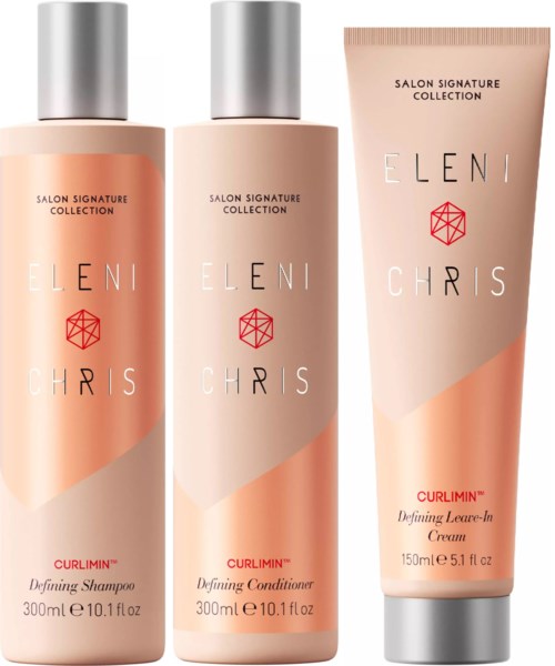 Drei Haarpflegeprodukte: Shampoo, Conditioner und Leave-in-Creme in peachfarbenen Flaschen und Tube.