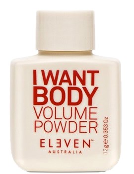 En liten vit flaska med röd och orange text. Den säger I WANT BODY VOLUME POWDER och ELVEN AUSTRALIA.