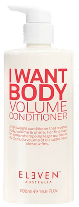 En vit flaska med pump märkt "I WANT BODY VOLUME CONDITIONER". Den innehåller hårbalsam för volym och glans.