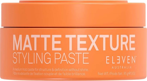 Oranger Behälter mit Matt-Textur Stylingpaste, Marke ELEVEN, aus Australien. Für Haarkosmetik.