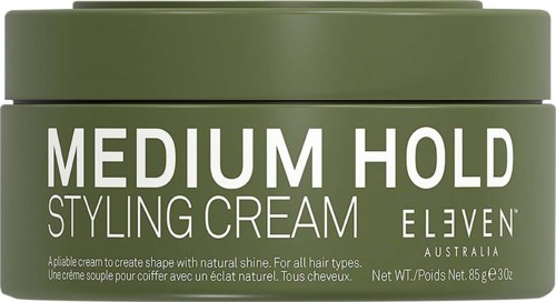 Grüne Dose mit Stylingcreme, Beschriftung 'Medium Hold' von Eleven Australia.