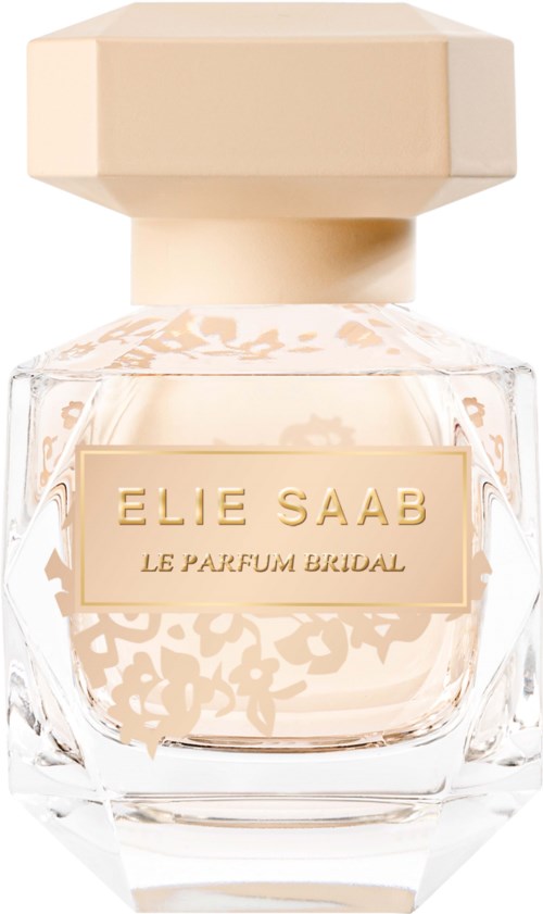 A perfume bottle with a large, beige cap and a clear glass body showing light pink liquid. The label says 'Elie Saab.'