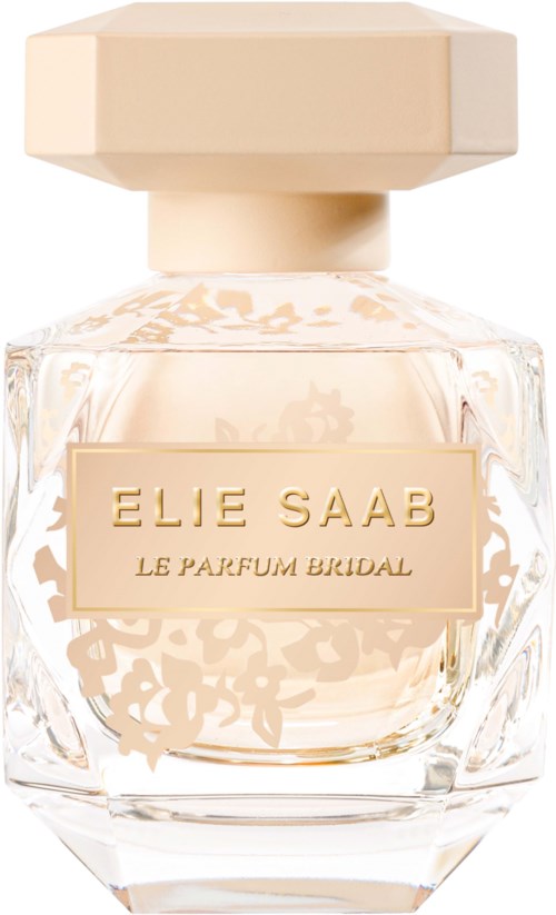 A perfume bottle with a light pink liquid, a big beige cap, and a gold label with the words "ELIE SAAB LE PARFUM BRIDAL."