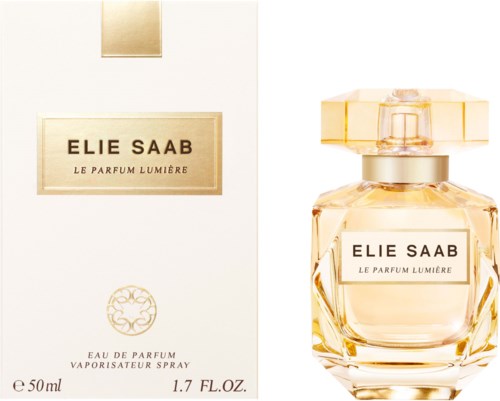 A perfume bottle and box labeled 'Elie Saab Le Parfum Lumière', with gold accents and a clear glass bottle.