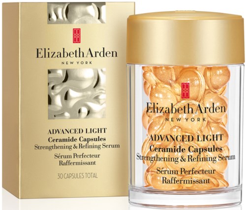 Ceramidi-kapselit lä pinossa, jossa kultainen kansi, laatikko näyttää tuotteen tiedot ja merkki, Elizabeth Arden, ihonhoitoon.