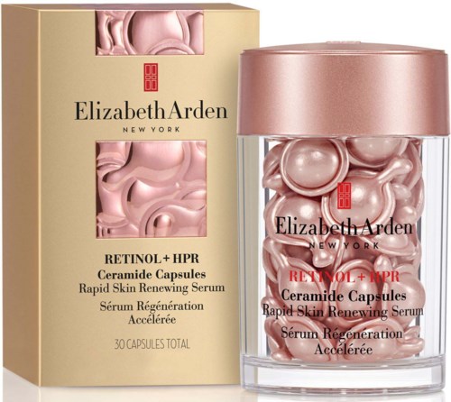 Elizabeth Arden retinol-kapselit, joissa vaaleanpunainen seerumi lasipurkissa ja laatikossa.